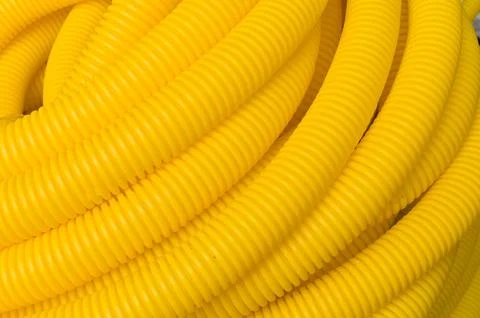 Roll of plastic yellow pipe, texture Stock Photos