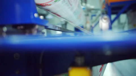 Roll of polycarbonate sheet unrolls by machinery equipment Stock Footage 228780943