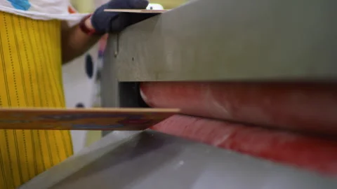 Roll press machine laminating puzzle Stock Footage 295342936