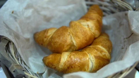 A roll of puff pastry in a wicker basket Vídeo Stock 86065658