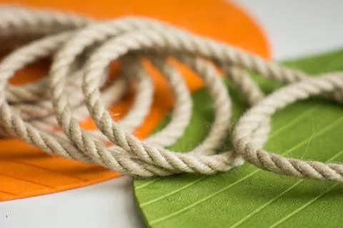 Roll of rough rope on the background Stock Photos