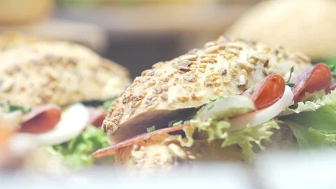 Roll with Salami and Lettuce Close Up Stock Footage 119278980