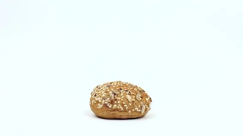 Roll with seeds on a white background Stock Footage 80868690