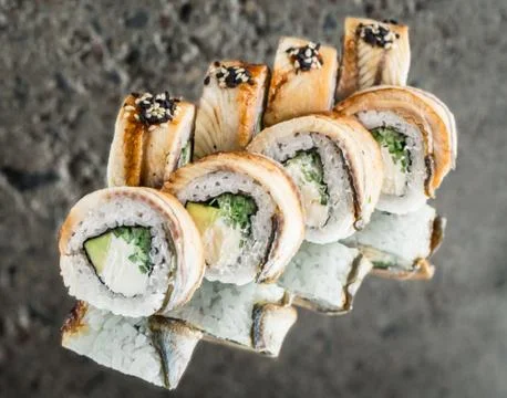 Roll with smoked eel, avocado, cucumber Stock Photos
