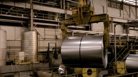 Roll of steel moved by crane - medium close up Stock Footage 89944556