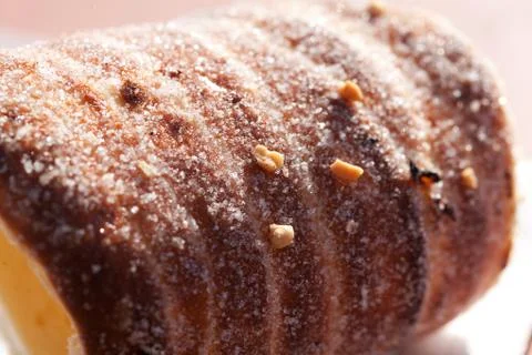 Roll with sugar and cinnamon on the table Stock Photos