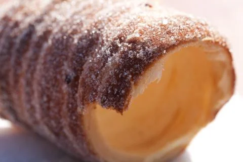 Roll with sugar and cinnamon on the table Stock Photos