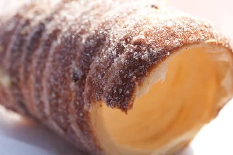 Roll with sugar and cinnamon on the table 스톡 사진