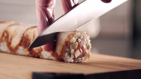 Roll Sushi cutting in slow motion Stock Footage 54550285