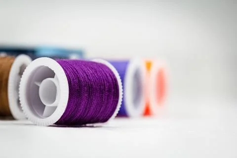 The roll of thread on background,show texture of purple thread,needlework,cra 스톡 사진