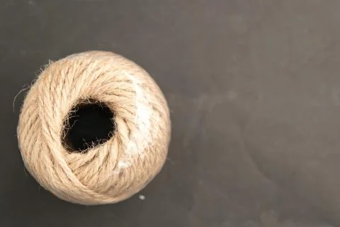 Roll of Thread on dark background with space for put the text Foto stock