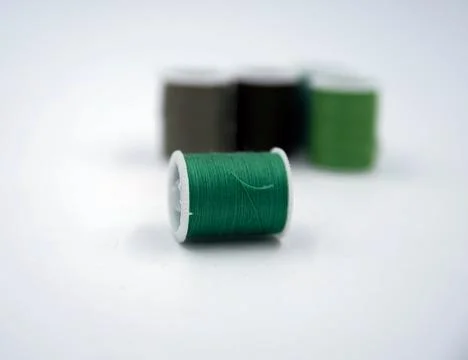 Roll of thread put on white background,show texture,for needle work Foto stock