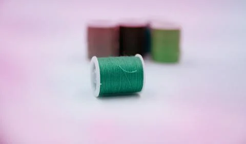 Roll of thread put on white background,show texture,for needle work Foto stock