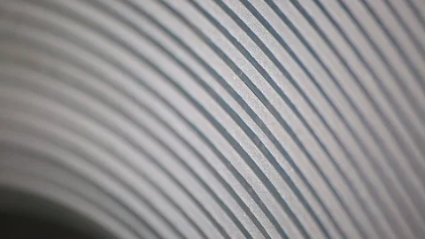 Roll tin close-up. lines as a hemisphere. create profiles. rolls of galvanized Stock Footage 94971853