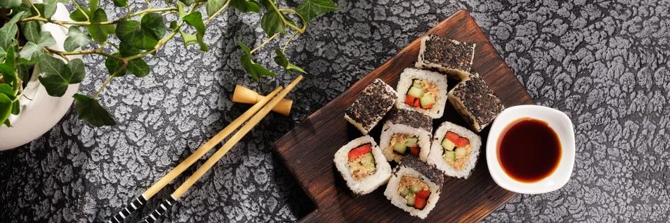Roll with vegetables and fish paste with a sesame cap. Sushi menu bar. Japane Stock Photos