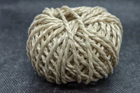 A roll of yarn on a black background Stock Photos