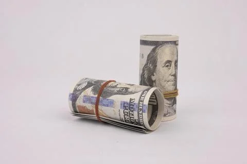 Rolled American dollars banknotes. Bundle of money roll of dollars isolated.. Фото