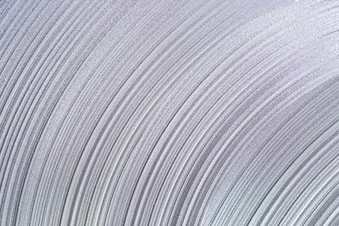 Rolled and bended stack of metal sheet decoration for background. Stock Photos