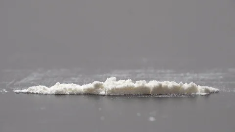 Rolled banknote snorting line of cocaine powder. Problems with drugs Stock Footage 123660500