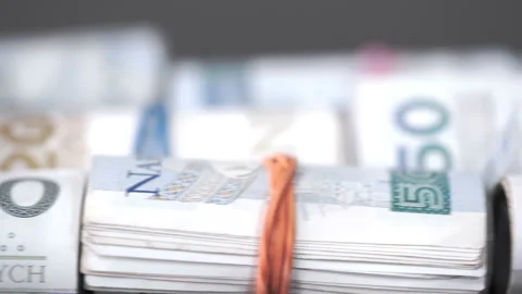 Rolled banknotes lie on a table side by side. Close-up view. Vídeo Stock 240558740
