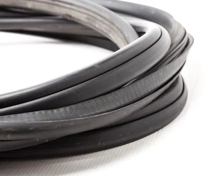 Rolled up black rubber sealant for elements of the car body, doors or trunk,  Stock Photos