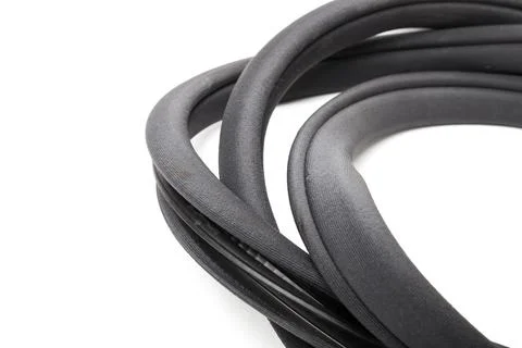 Rolled up black rubber sealant for elements of the car body, doors or trunk,  Foto stock