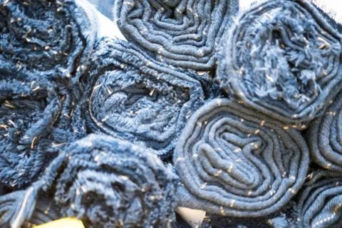 Rolled blankets sorted on top of each other. Rolled blanket in a blanket stor Stock Photos