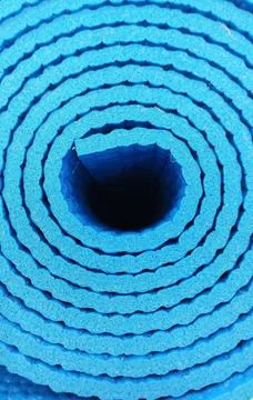 Rolled up blue carpet Stock Photos