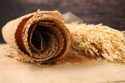Rolled brown chia seed bread on a table Stock Photos