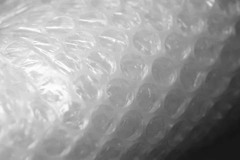 Rolled bubble wrap, macro photo with selective focus Stock Photos