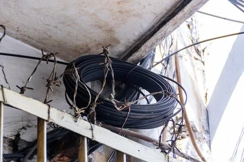 Rolled cable put under the white outdoor ceiling 写真素材