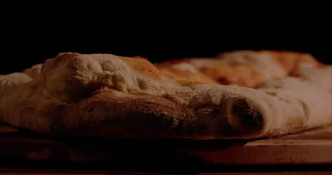 Rolled Calzone Rotating Closeup, Black Background Stock Footage 130940595