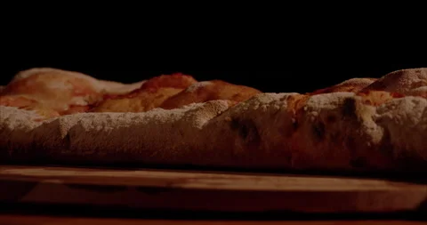 Rolled Calzone Rotating Closeup, Black Background Stock Footage 130940624