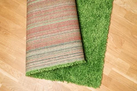 Rolled carpet on the floor Stock Photos