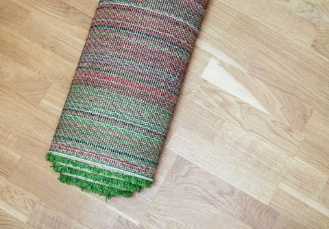 Rolled carpet on the floor Stock Photos