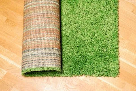 Rolled carpet on the floor Stock Photos