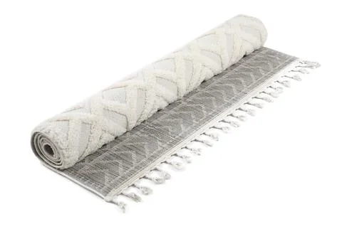 Rolled carpet with pattern on white background. Interior element Stock Photos