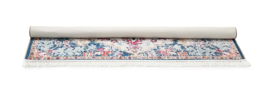 Rolled carpet with pattern on white background. Interior element Foto stock