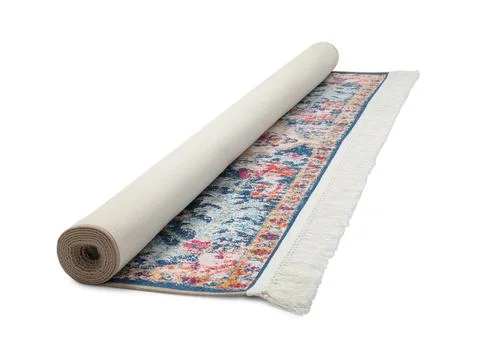 Rolled carpet with pattern on white background. Interior element Foto stock