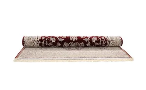 Rolled carpet with pattern on white background. Interior element 스톡 사진