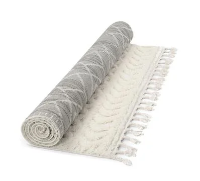 Rolled carpet with pattern on white background. Interior element Foto stock