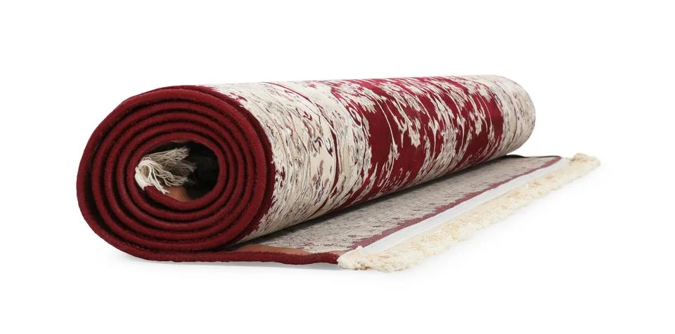 Rolled carpet with pattern on white background. Interior element Stock Photos