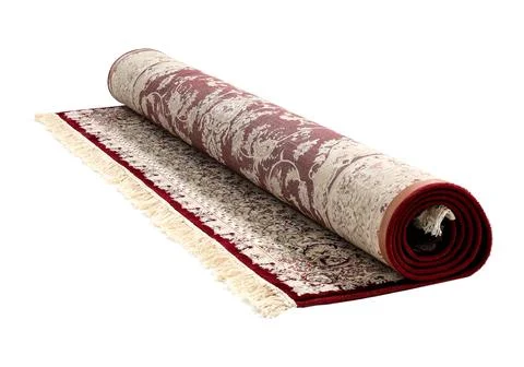 Rolled carpet with pattern on white background. Interior element 스톡 사진