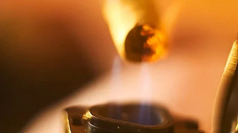 Rolled Cigarrette Cigar Cigarillo Macro Lit with Lighter Fire Flame Vídeo Stock 105934247