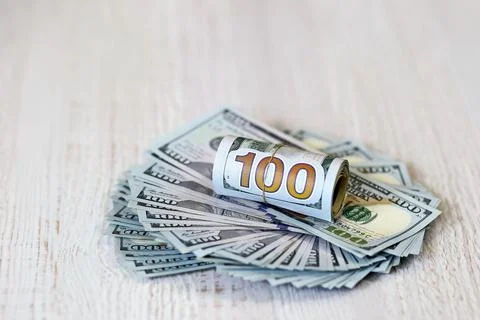 Rolled-up dollar bills Stock Photos
