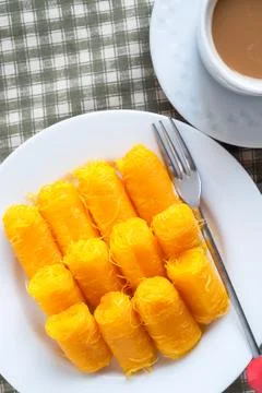 Rolled egg yolk thread or Thai style fios de ovos. Stock Photos