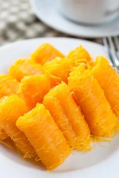 Rolled egg yolk thread or Thai style fios de ovos. Stock Photos
