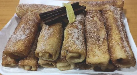 Rolled french toast flavored with cinnamon Stock Photos