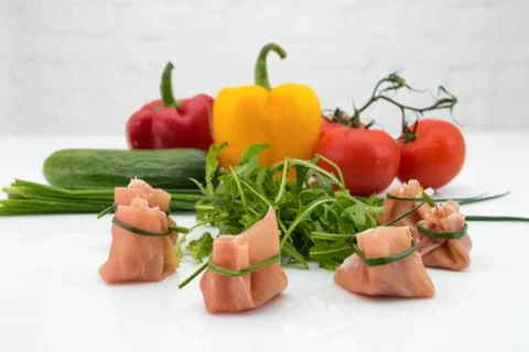 Rolled ham and raw vegetables Stock Photos