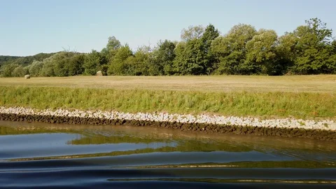 Rolled Hay in fields along the Main River in Germany Stock Footage 124675546